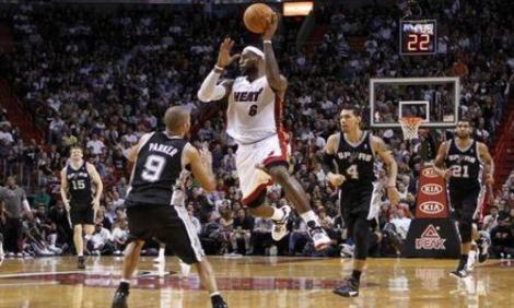Reuters LeBron in transition as the Spurs swarm in an earlier matchup of this year's Finals competitors. 