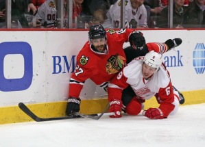 Jonathan Daniel/Getty Images Johnny Oduya mixes it up with Justin Abdelkader of the Detroit Red Wings in a 2014 clash. 